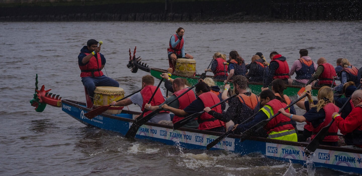 Two dragon boats racing