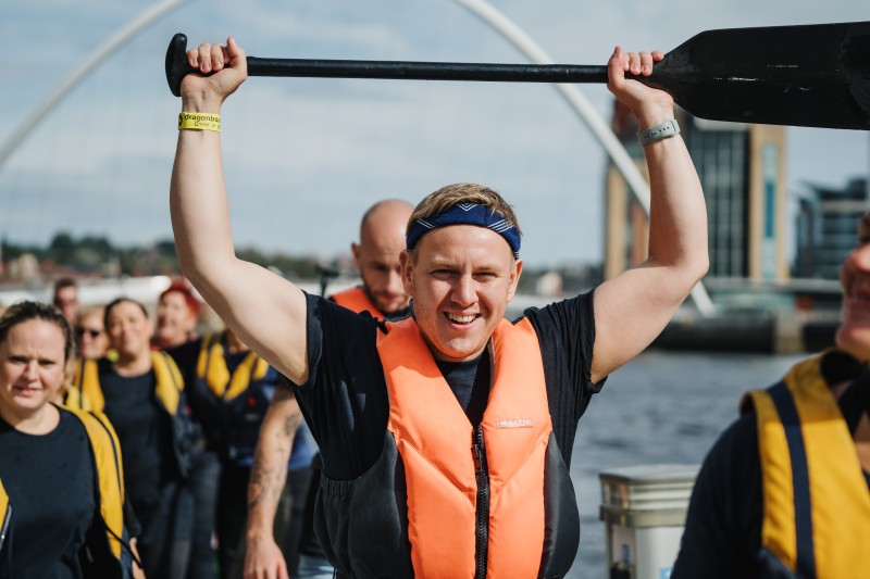 Man with paddle celebrating